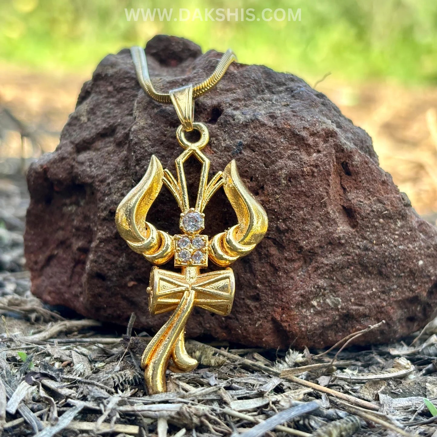 The Trident, Om and Damaru—Shiva's drum—form a sacred triadic necklace, symbolizing strength and protection.