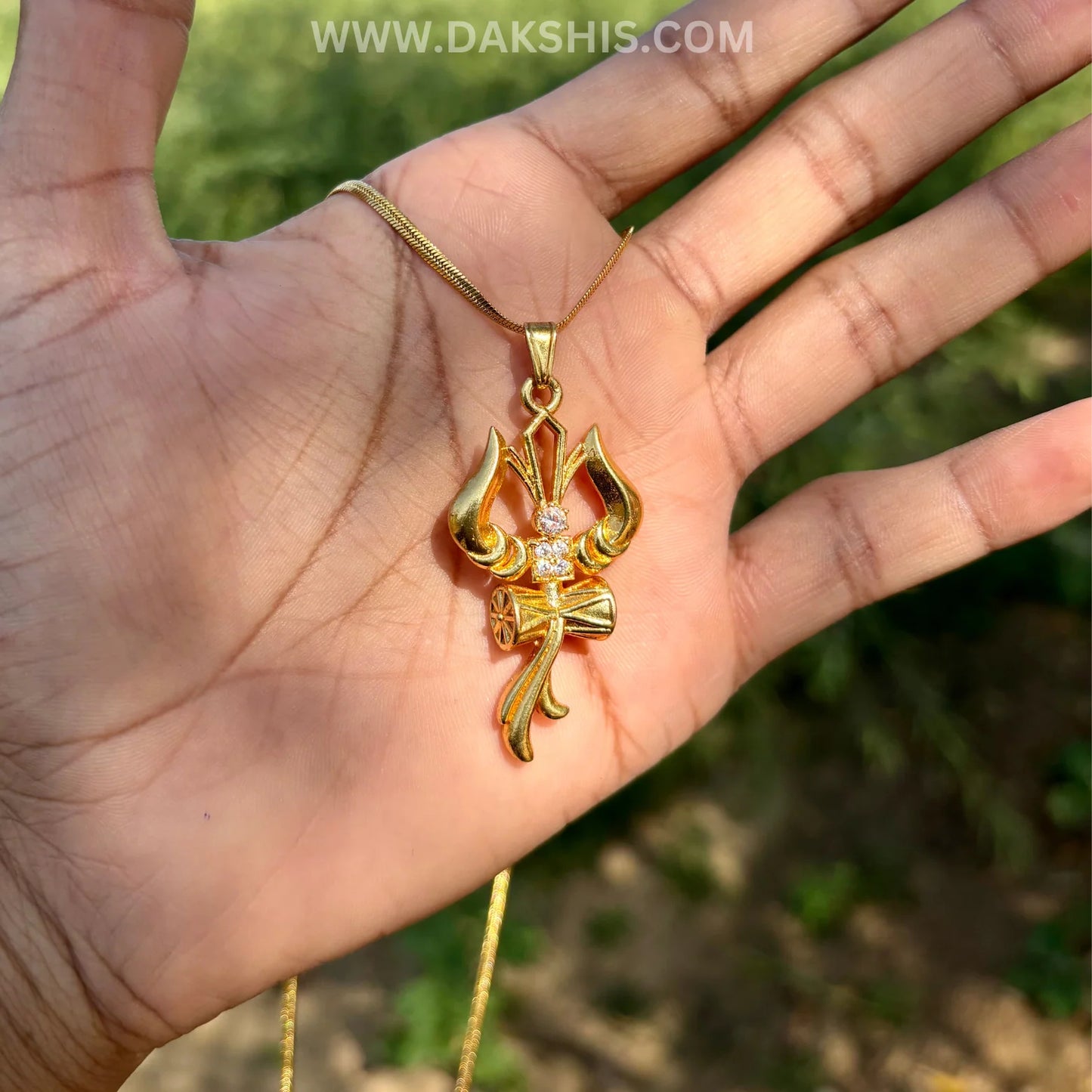 The Trident, Om and Damaru—Shiva's drum—form a sacred triadic necklace, symbolizing strength and protection.